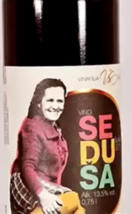 The current Seduša bottle, with a family portrait on the label